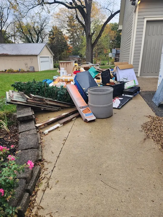 Dumpster being loaded with debris for Roofing Dumpster Rental in Portland
